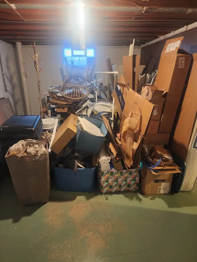 Roll-off dumpster container at job site for 2 Yard Dumpster Rental in Wharton